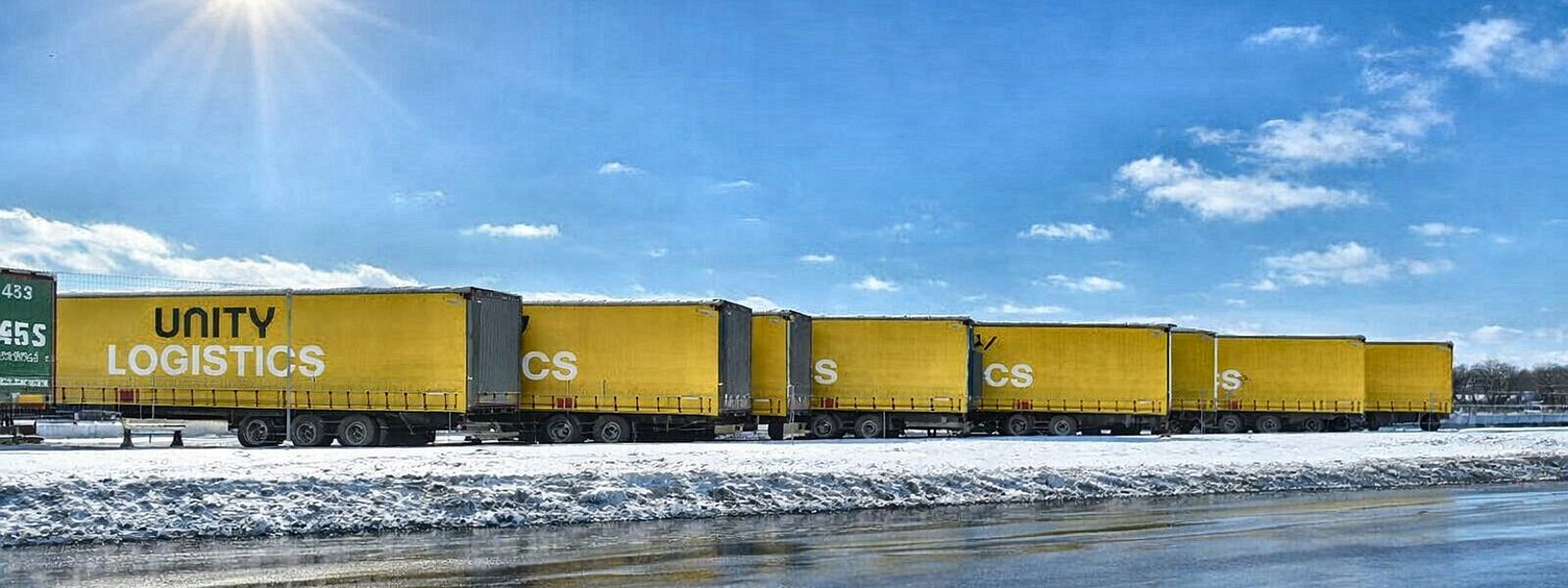 Unity Logistics trailers lined up at the yard